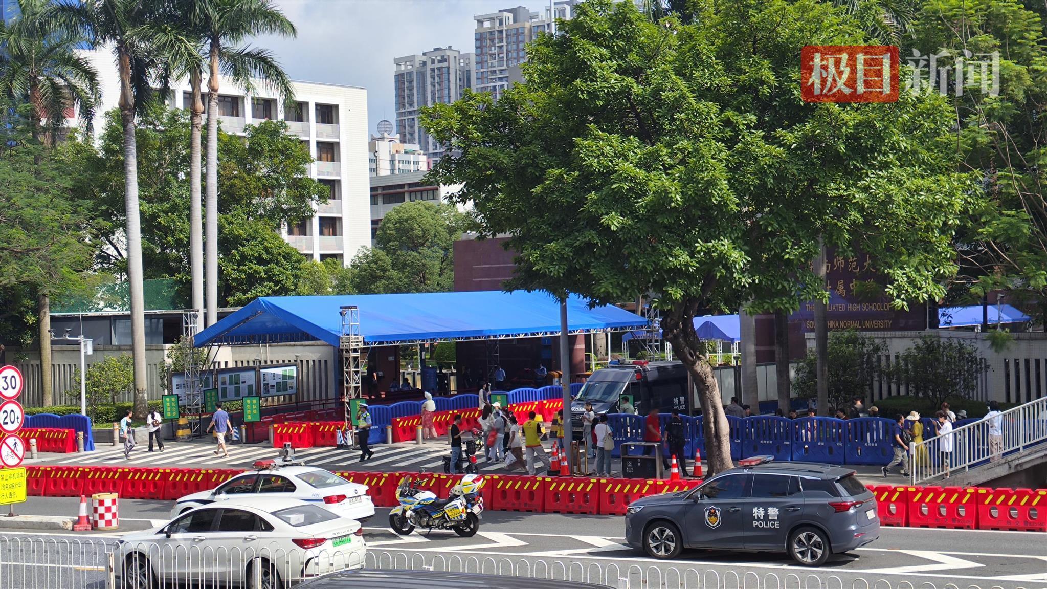 高考首日直击广州华师附中考点：校门外设置水马疏导交通，有家长六点起床送考
